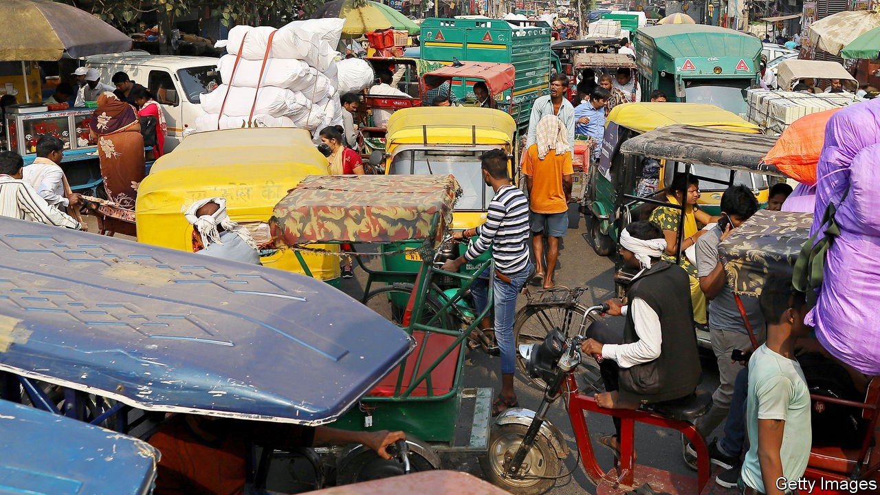 Auto-rickshaws sit in traffic near Sadar Bazaar in New Delhi, India, on Wednesday, Nov. 20, 2019. In the heart of New Delhi's largest wholesale bazaar, merchants who normally compete with each other have united against a common enemy. The sit-in, which created more chaos than usual among the rickshaws, motorbikes and ox-carts plying the market road, was one of as many as 700 protests against Amazon.com Inc. and Walmart Inc. -- owner of local e-commerce leader Flipkart -- that organizers say took place at bazaars across India on a recent Wednesday. Photographer: Anindito Mukherjee/Bloomberg via Getty Images