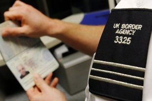 A UK Border Agency worker poses with a passport during a demonstration of the new facial recognition gates at the North Terminal of Gatwick Airport near London, November 23, 2009. The gates can be used by any British or EEA national who holds a biometric passport and are designed to speed travellers through immigration control. REUTERS/Luke MacGregor (BRITAIN TRANSPORT TRAVEL) - GM1E5BN1M2F01