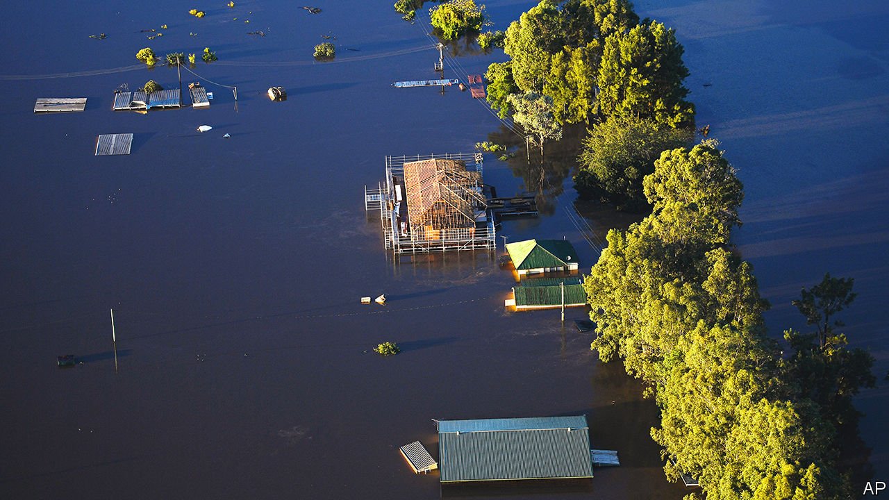 Buildings are partially submerged as floodwater covers large areas, northwest of Sydney, Wednesday, March 24, 2021. Some 18,000 residents of Australia's most populous state have fled their homes since last week, with warnings the flood cleanup could stretch into April. (Lukas Coch/Pool Photo via AP)